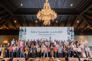 Distinguished speakers and participants engage in a dynamic panel discussion during the Path to Sustainable Growth 2025 summit at The Apurva Kempinski Bali.