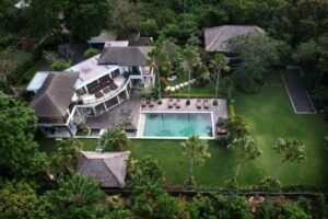A serene tropical escape where lush gardens and ocean views create the ultimate villa experience.