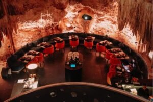 The Cave’s stunning subterranean dining room in Uluwatu offers an otherworldly atmosphere — where dramatic lighting, natural limestone walls, and refined elegance create an immersive backdrop for Chef Ryan Clift’s visionary tasting experience.