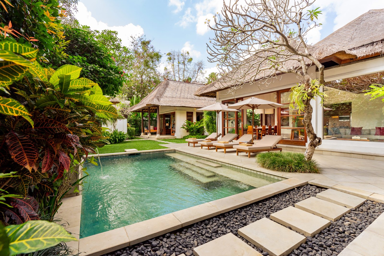 A cozy family-friendly retreat in Jimbaran, Villa Umarya offers serene poolside living just steps from the beach.