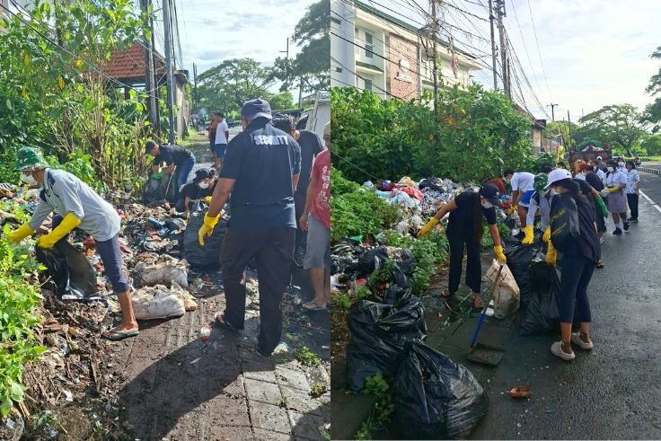 Volunteers remove illegally dumped waste during a community clean-up along Jl. Prof. Dr. Ida Bagus Mantra Gianyar.